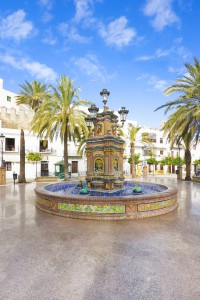 Beautiful and multi-colored fountain in a square, multi-tiered