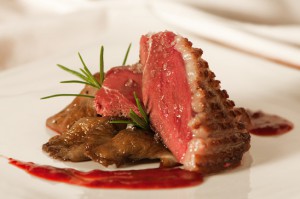 Duck breast with raspberry sauce and mushrooms